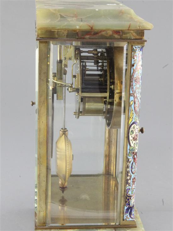 An early 20th century French champlevé enamel and onyx four glass clock, 11.5in.